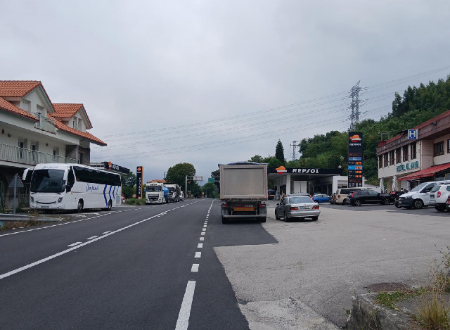 A truck stop at the top of a hill. There are two hotels here. I considered staying here tonight but ...