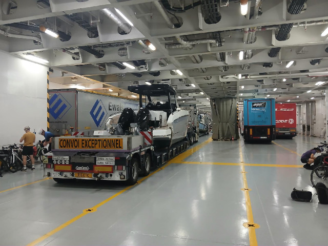 Some of the lorries on this ferry are carrying quite large boats.