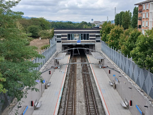 A station at the entrance to a tunnel.