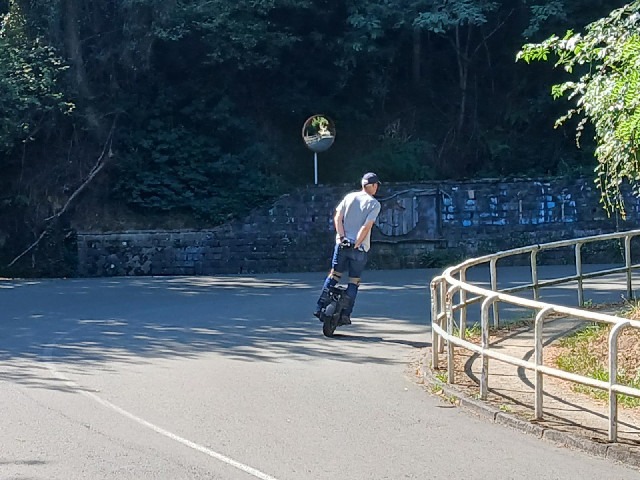 One of several people going up the hill on these contraptions.