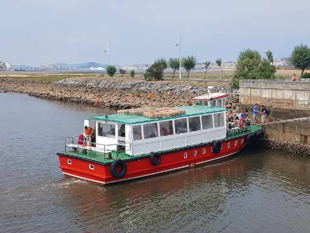 The white shape in front of the dark green hill in the distance is the ship which brought me from Po...