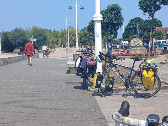 Three touring cyclists have just arrived to get the ferry across to Santander. It's hard to tell fro...