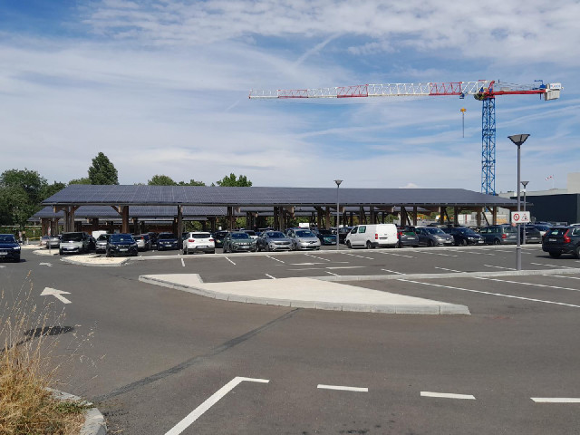 Here's something that I've seen a few times on this trip: structures which keep the Sun off parked c...
