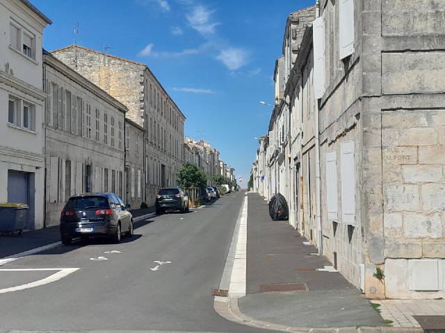 Rochefort. The huge French flag which is visible from everywhere on this road is on the Town Hall.