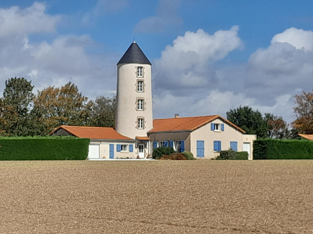 An unusual house. I wonder if it was once a windmill.