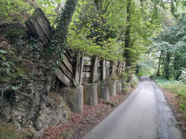 There are some sturdy planks holding that earth bank in place.
