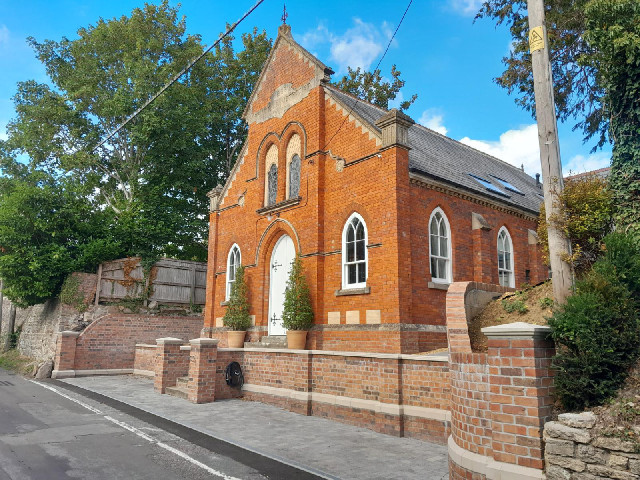 I don't know whether this is still a church or whether it's a house now but it has a place to charge...