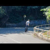 One of several people going up the hill on these contraptions.