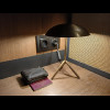 The desk has a very small lamp.