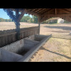 Instead, I'm getting some shade from this structure which contains a large concrete trough.