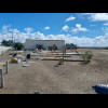 An unattended exhibition of some kind next to the beach.