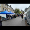 The stall on the left sells shellfish. The blackboard is advertising mussels from Utah Beach.