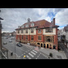 My view is dominated by the town hall, although that milestone is also sitting there at the end of t...