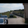 The route recommended by Google Maps goes that way, along the pilgrim route. Roughly where the path ...